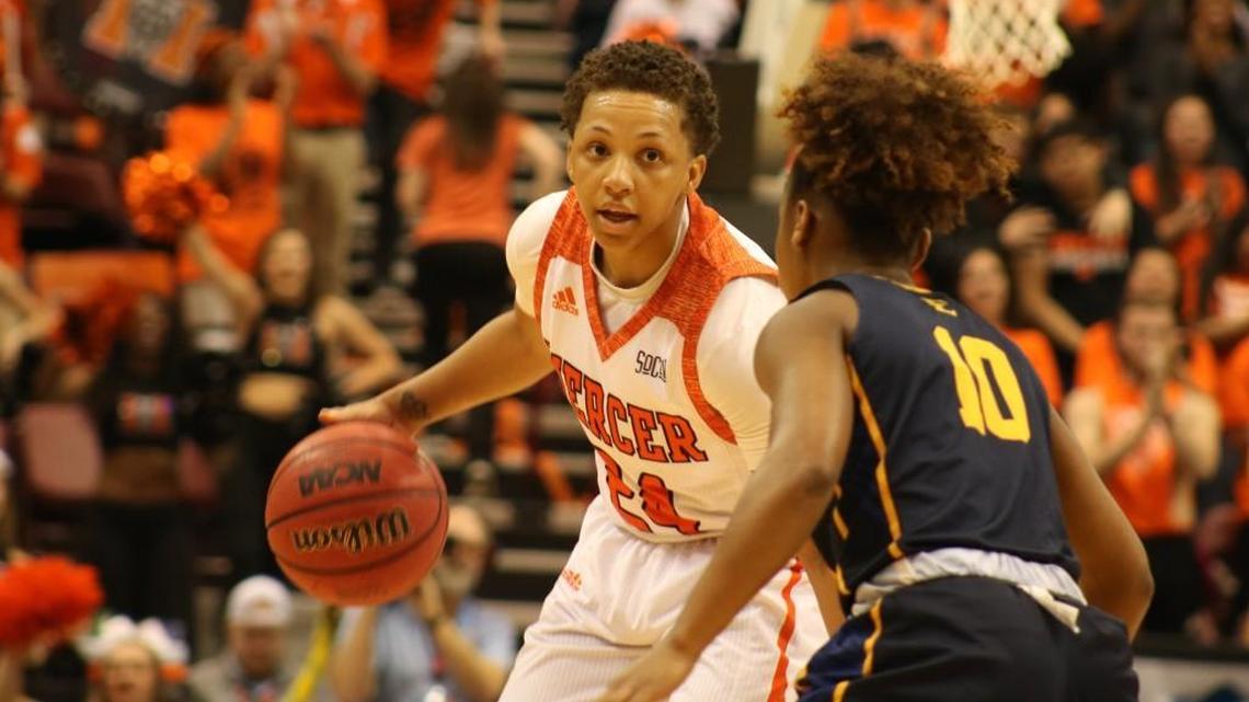 Kahlia Lawrence faces up against East Tennessee's Jada Craig (No. 10) during Mercer's SoCon Championship victory.