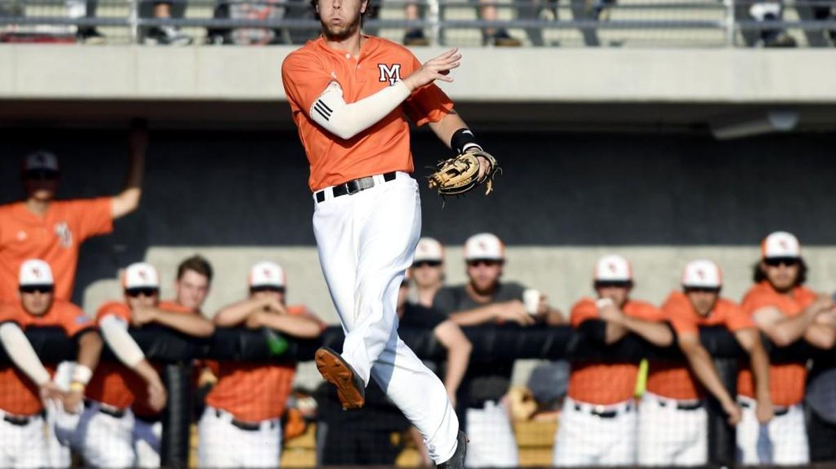 Mercer third baseman Danny Edgeworth (21) throws the ball to first after running down a bunt single by Georgia Tech's Chase Murray (10) during their game Tuesday night. Georgia Tech won 11-3.