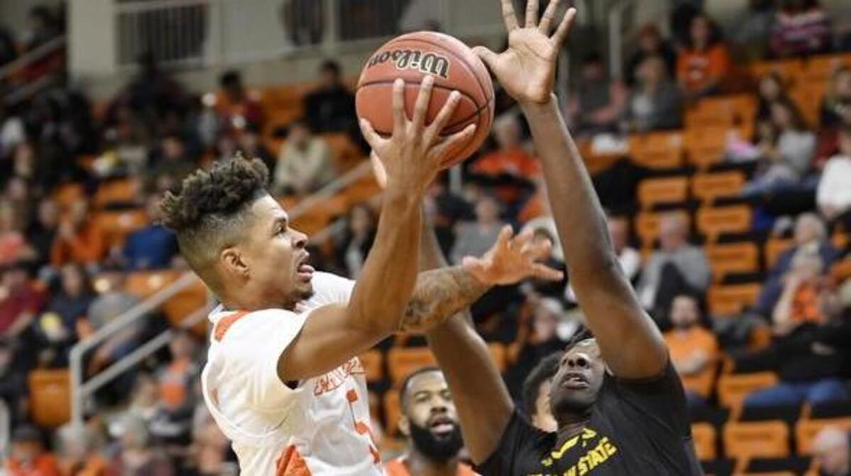 Mercer’s Jordan Strawberry (5) drives to the basket as Kennesaw State’s Anthony Wilson (1) defends Thursday night at Hawkins Arena.