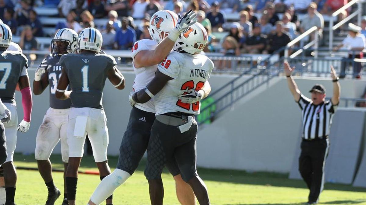 Tee Mitchell, right, and Chris Ellington celebrate one of Mitchell’s touchdowns Saturday against The Citadel.