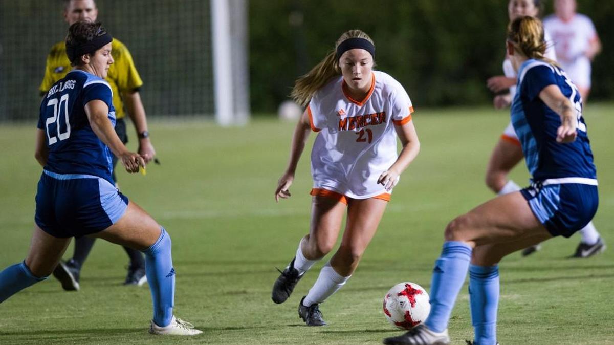 Mercer’s Ally Fordham (21), center, dribbles the ball with the Citadel’s Kate Mansion (20) and Ray Brown (12), left to right, defending in their game at Mercer on Oct. 25.