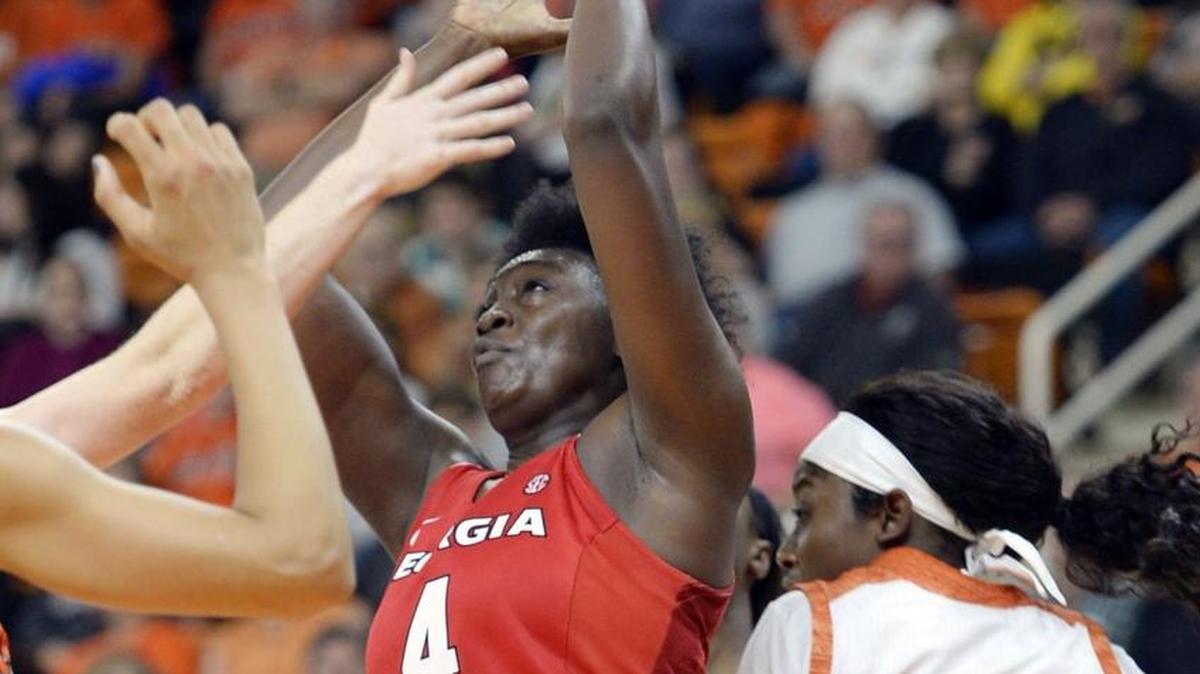 Georgia's Kaliya Robinson (4) pulls down a rebound after a shot by Mercer's Alex Williams (22) during second half action. Georgia beat Mercer, 72-54.