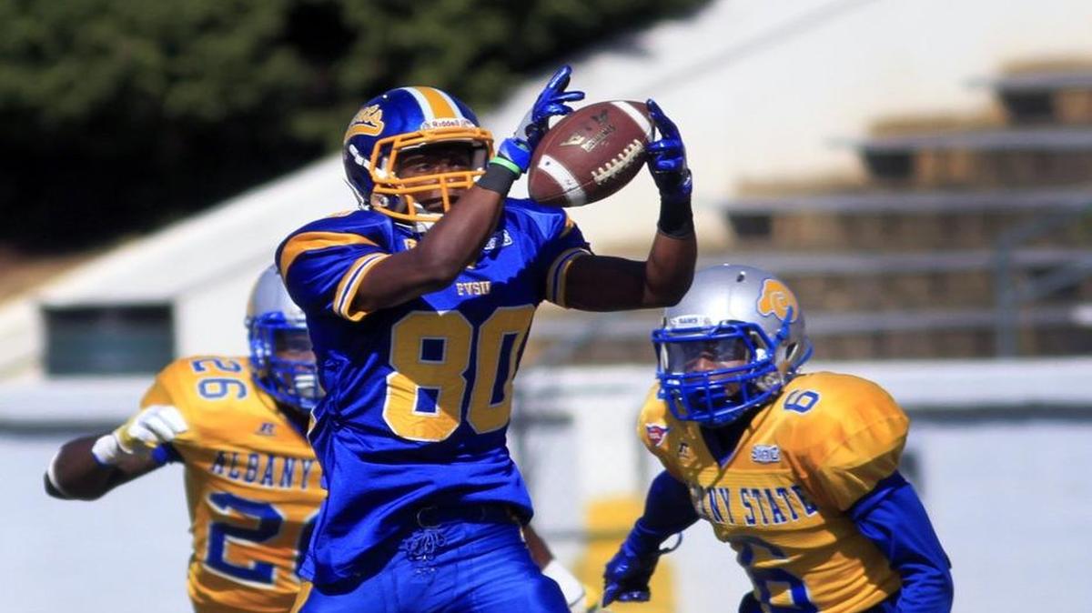 Fort Valley wide receiver Jeffery Mack catches a pass while being defended by Albany State players Ryan Selby, left, and Marquiz Hodo in the first half Saturday afternoon.