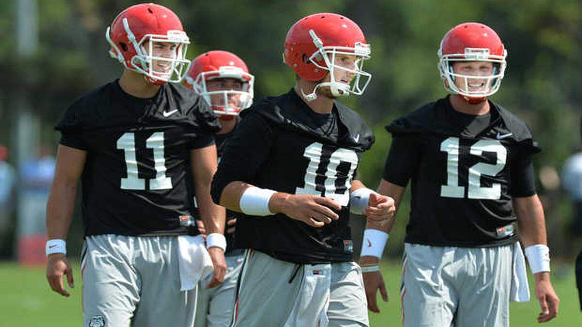 Georgia quarterbacks Greyson Lambert (11) won the starting quarterback job, with Faton Bauta (10) and Brice Ramsey(12) backing him up.