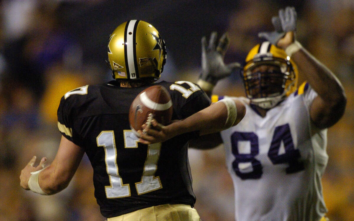 Former LSU defensive lineman Marcus Spears attempts to defend a pass against Vanderbilt during a game in 2004. 