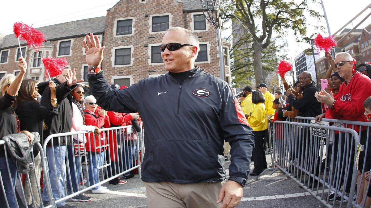 Mark Richt waves during Georgia's pre-game walk against Georgia Tech. 