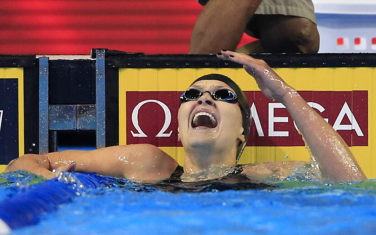 Olivia Smoliga reacts after winning the 100-meter backstroke at the U.S. Olympic Trials.