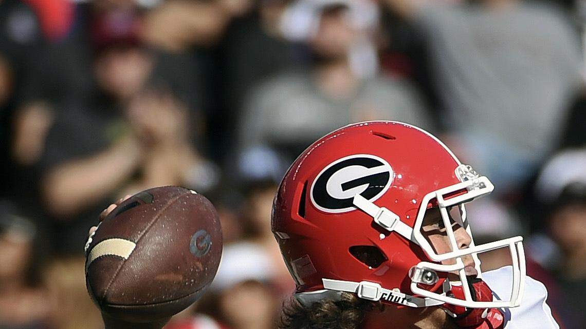 Jacob Eason attempts a pass during Sunday's game against South Carolina