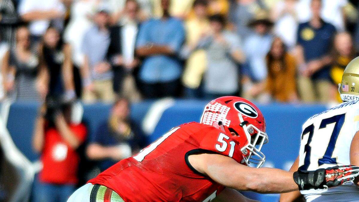 Jake Ganus attempts to make a tackle during Georgia's 13-7 win over Georgia Tech. 