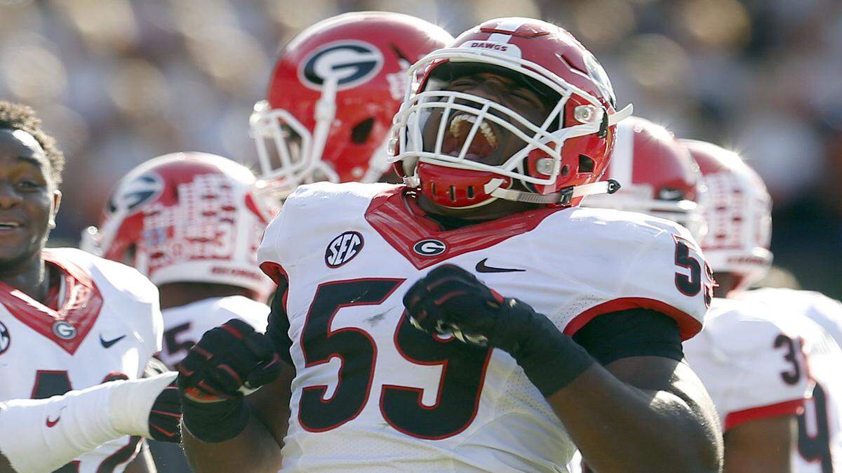 Jordan Jenkins celebrates after an Auburn fumble in the second half. 