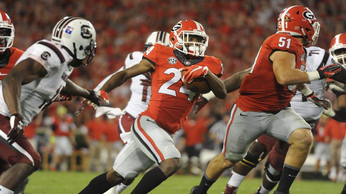 Dominick Sanders returns an interception during Georgia's win against South Carolina. 
