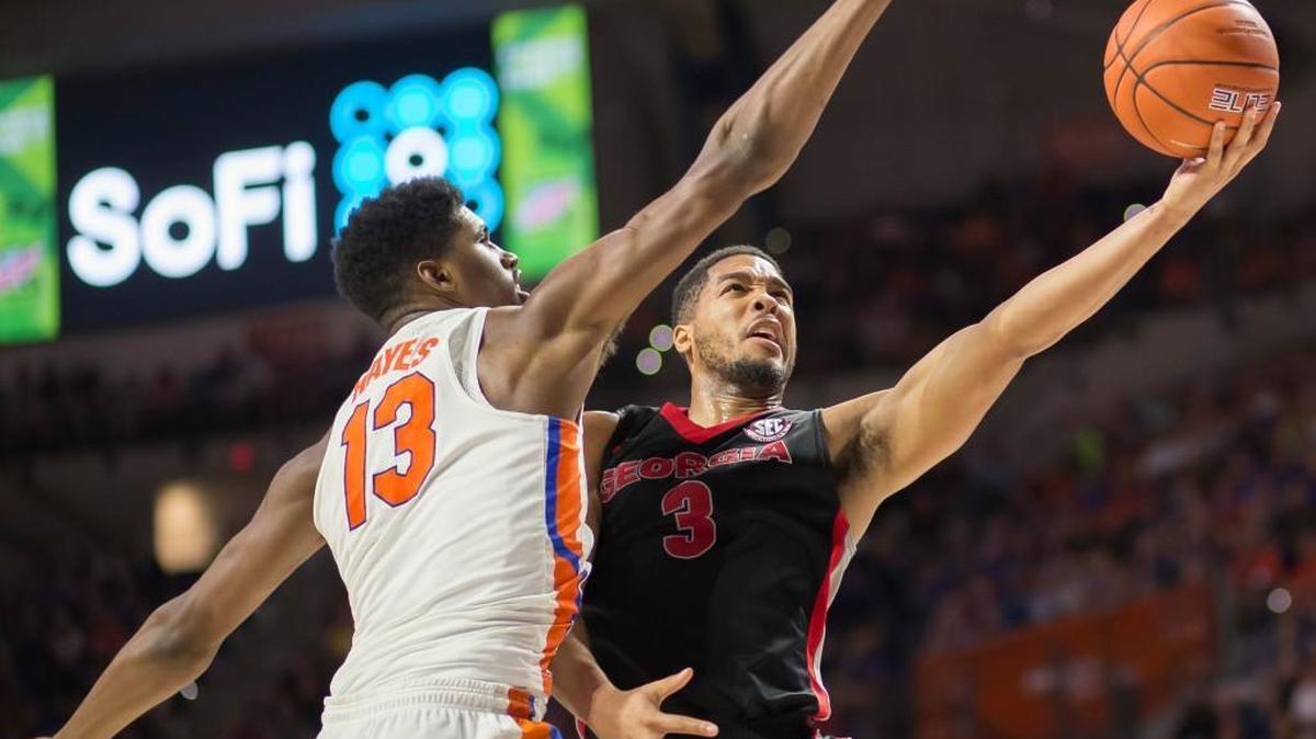 Georgia guard Juwan Parker (3) shoots over Florida forward Kevarrius Hayes (13).