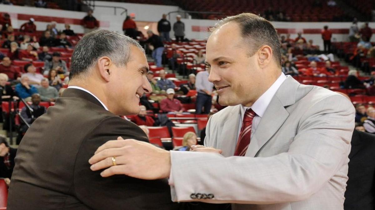 Georgia head coach Mark Fox (right) greets South Carolina head coach Frank Martin before a game.