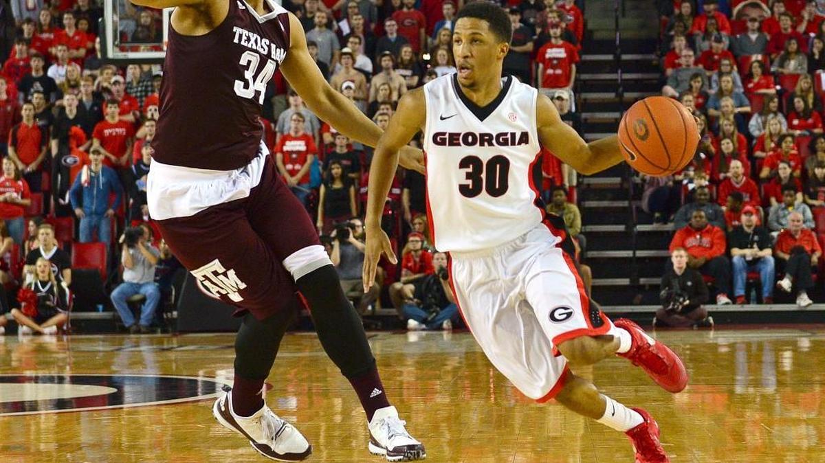 Georgia guard J.J. Frazier drives against Texas A&M center Tyler Davis during last year’s game between the two teams.