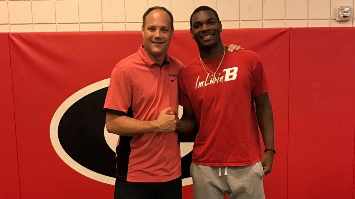 Georgia head coach Mark Fox, left, recently offered a scholarship to Buford’s Marcus Watson.