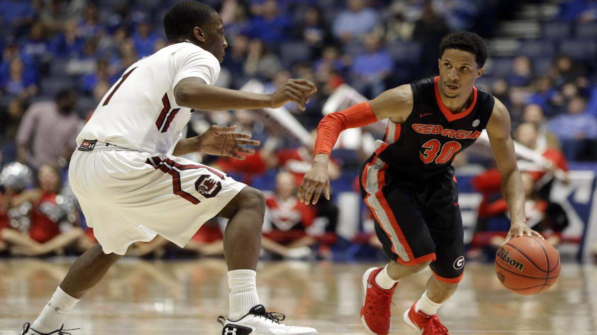 J.J. Frazier dribbles the ball against Marcus Stroman. 