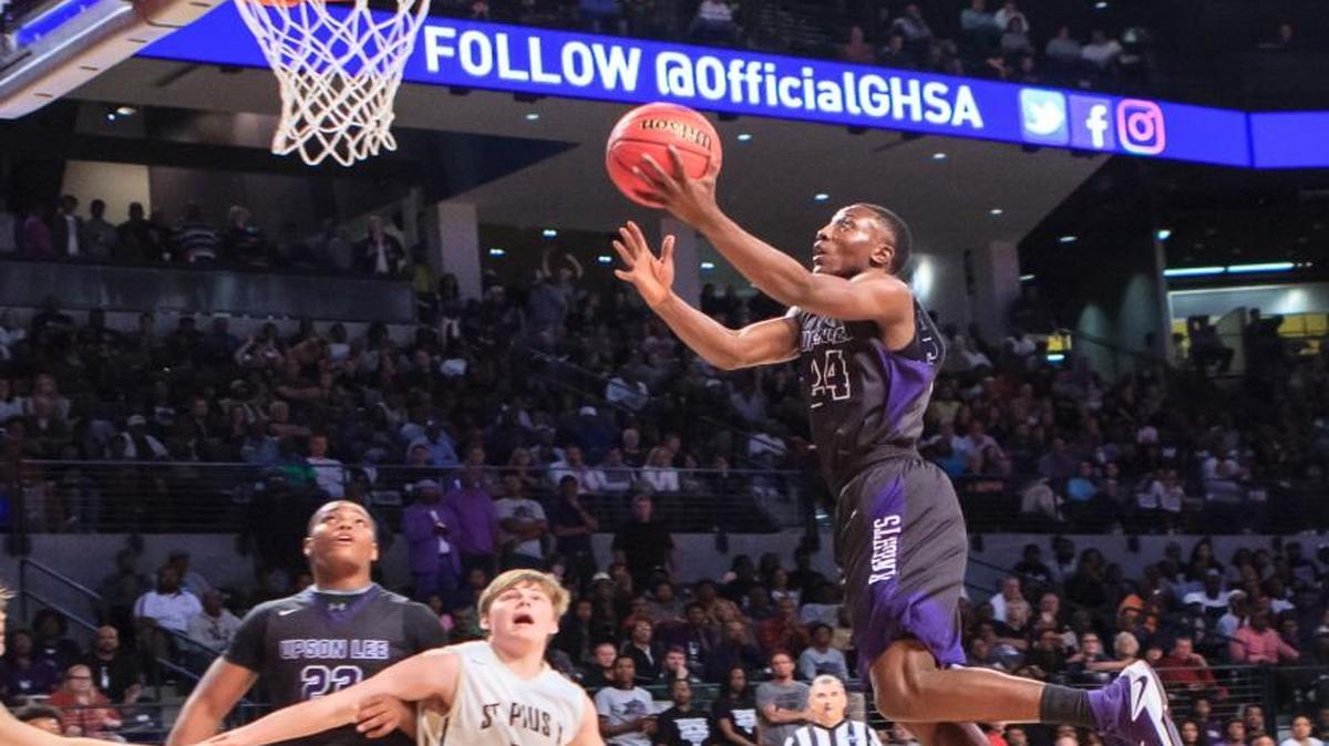 Upson-Lee's Tavias Fagan (24) glides into the lane to score in the Knights’ GHSA Class 4A final against St. Pius X.