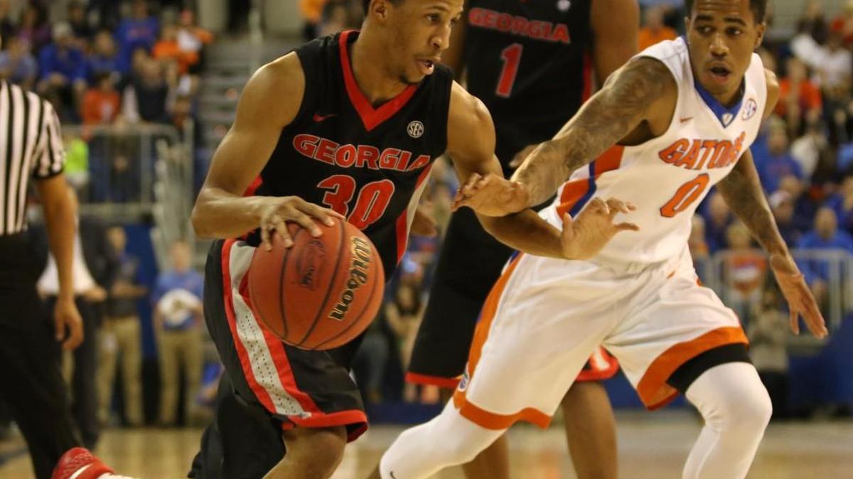 Georgia guard J.J. Frazier drives toward the basket in last year’s game against Florida.
