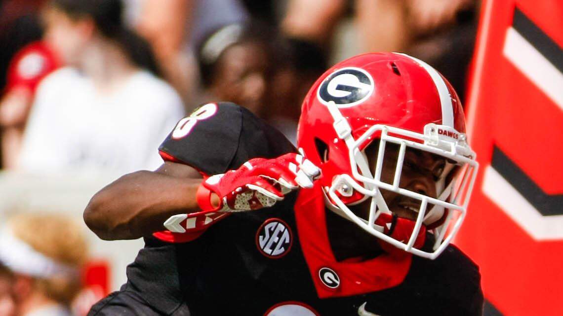 Mecole Hardman catches a pass in coverage during Georgia's annual G-Day spring football game. 