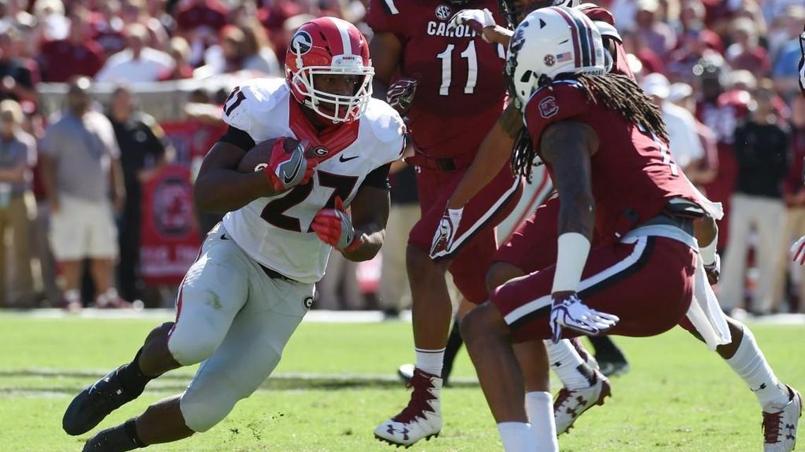 Georgia running back Nick Chubb (27) runs against South Carolina Sunday.