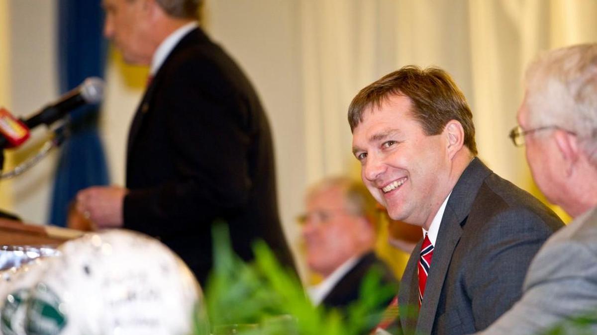 Georgia head coach Kirby Smart smiles as he is introduced by Mike Cavin at the 2016 Macon Touchdown Club jamboree.
