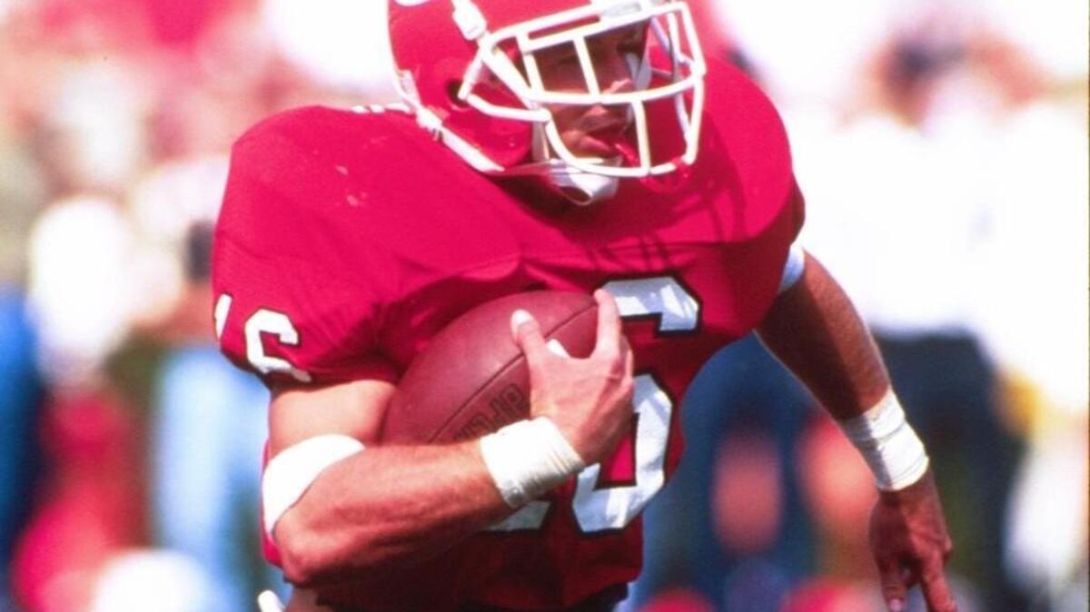 Kirby Smart carries the ball while a defensive back at Georgia.