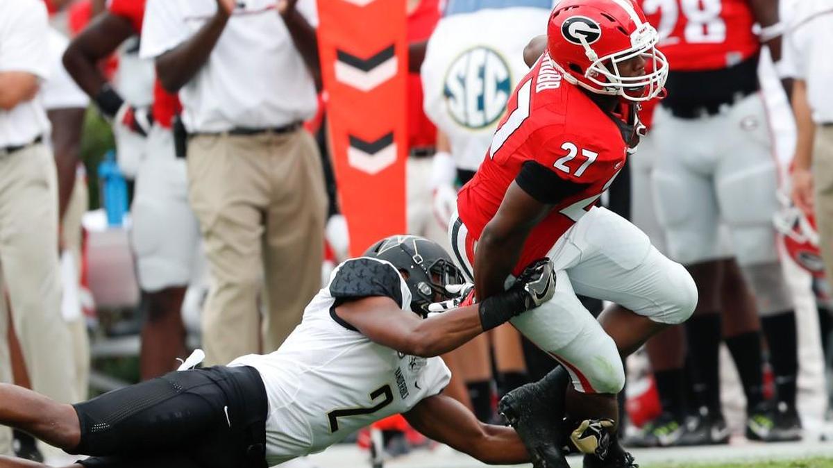 Georgia running back Nick Chubb (27) is unable to escape from Vanderbilt safety Arnold Tarpley (2) in Saturday’s loss.