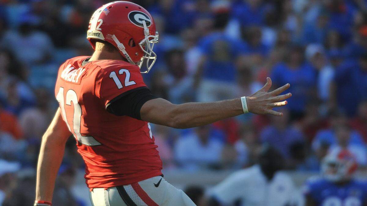 Brice Ramsey attempts a punt in Georgia's 2015 game against Florida. 