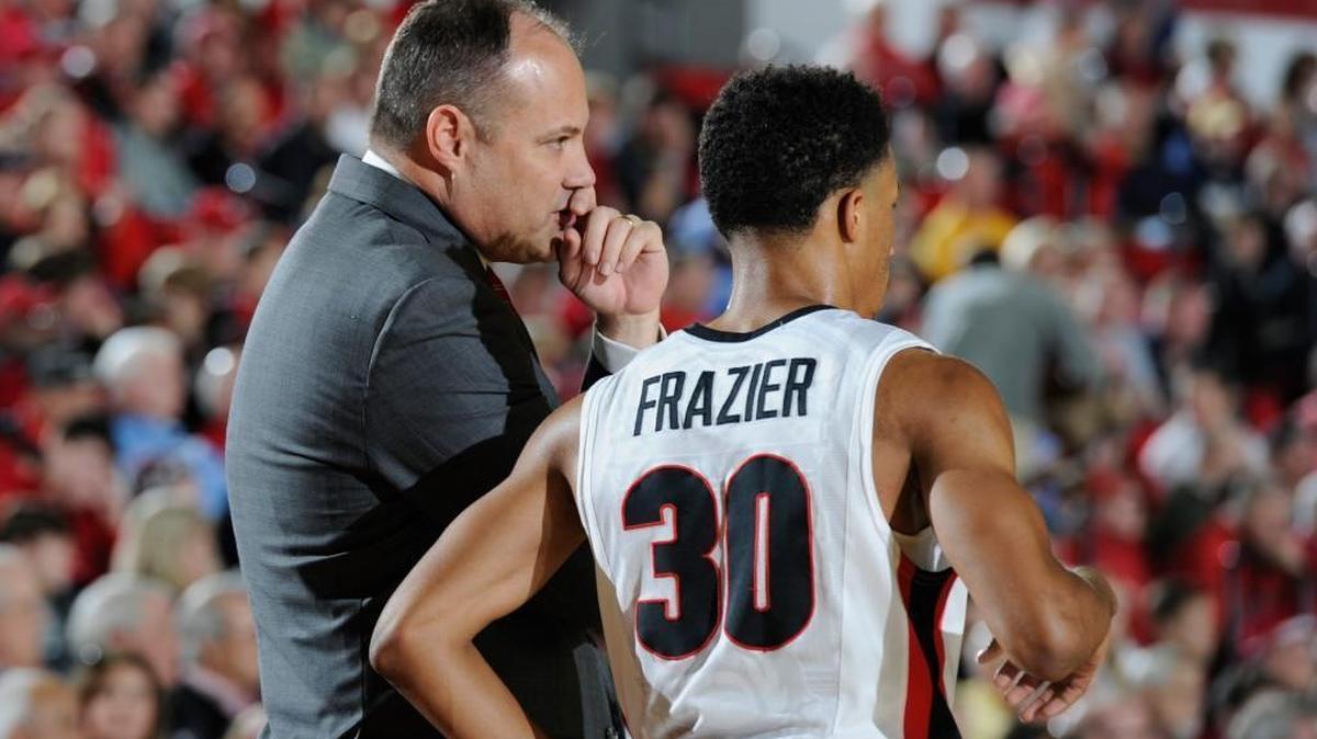 Georgia head coach Mark Fox talks with guard J. J. Frazier (30).