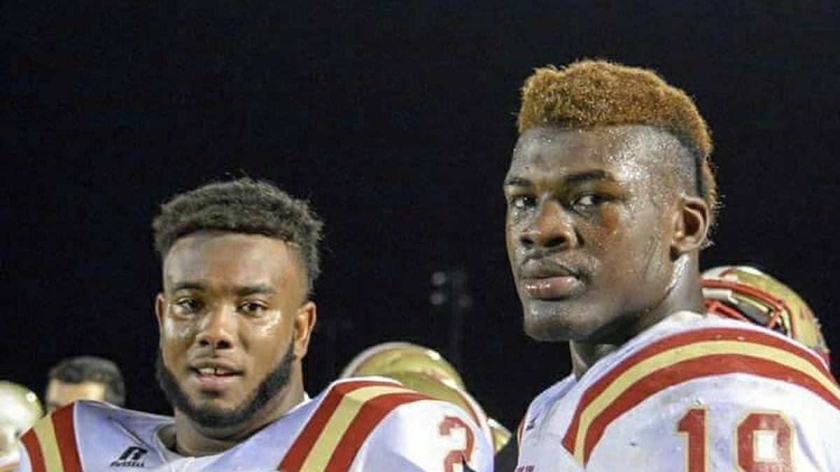 Jamarcus Chatman (L) looks on with Adam Anderson during a game as Rome teammates.