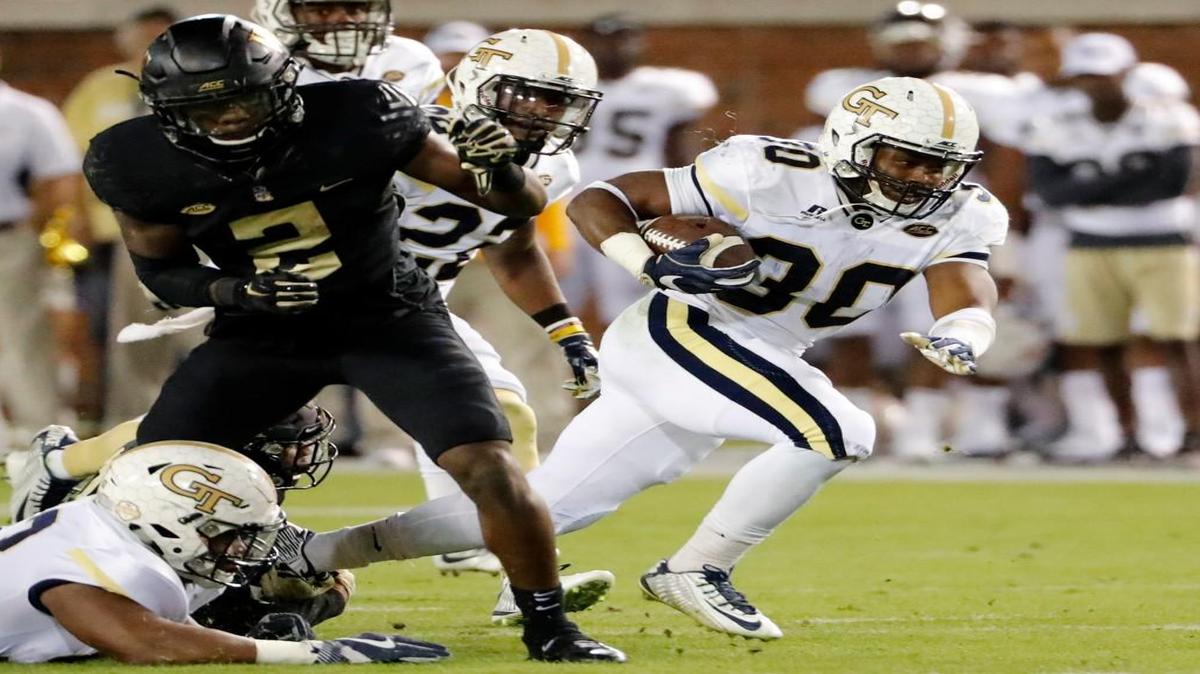 Georgia Tech's KirVonte Benson runs the ball in an offense that employs a large number of cut blocks up front.