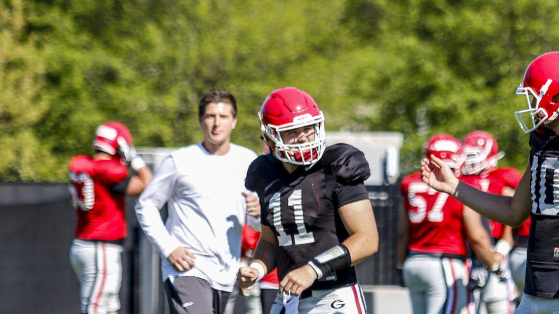 Jake Fromm (left) and Jacob Eason (right) work through a drill during spring practice. 
