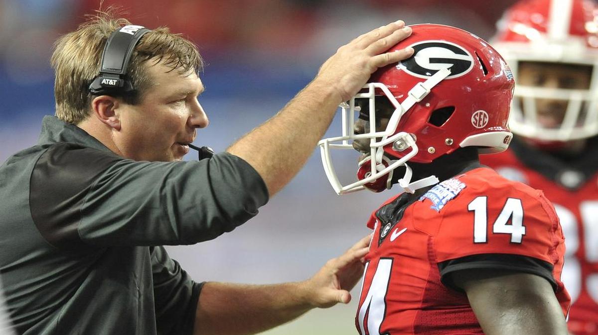 Georgia head coach Kirby Smart speaks with defensive back Malkom Parrish.