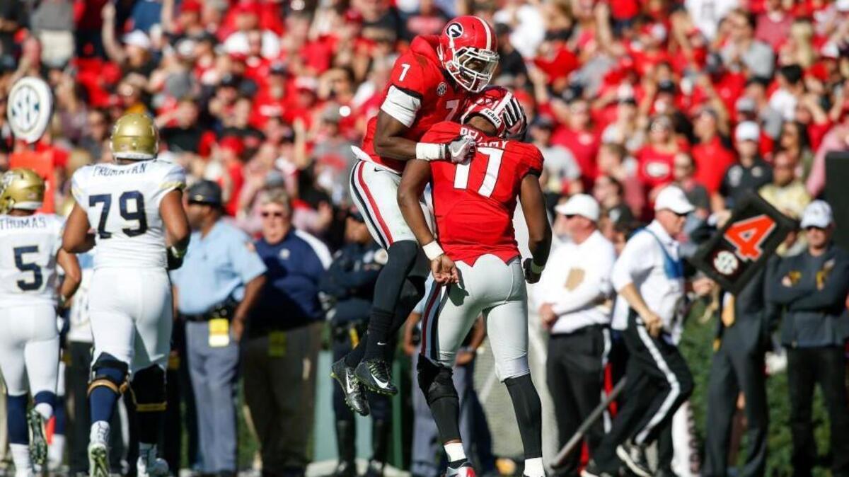 Lorenzo Carter (7) and Davin Bellamy (17) are poised for big senior seasons.