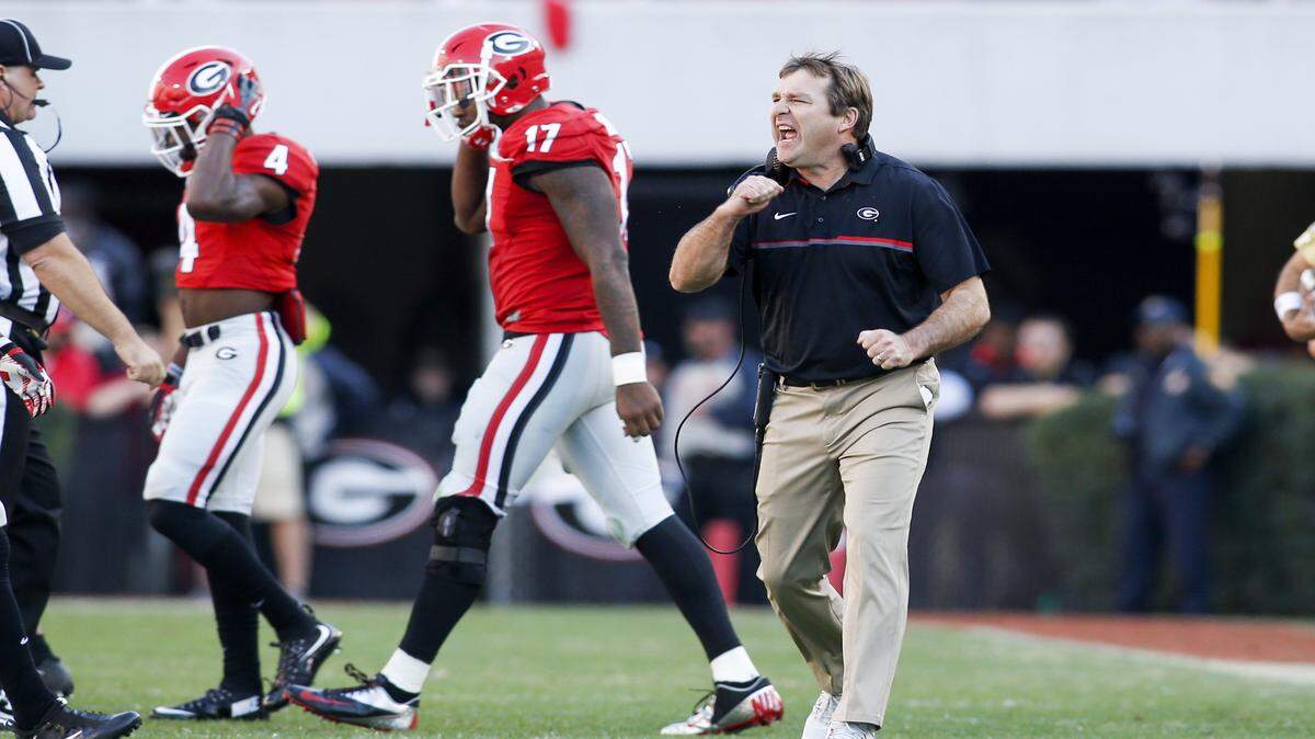 While he's not arguing a call in this photo, UGA head coach Kirby Smart, along with his coaching colleagues, will receive an immediate 15-yard unsportsmanlike conduct penalty for walking onto the field to argue an officiating ruling in 2017. 