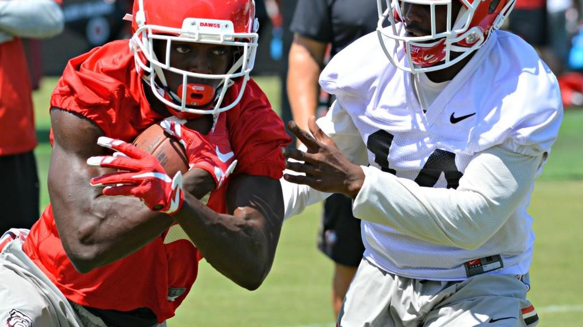 Georgia receiver Mark Webb (81) and defensive back Malkom Parrish compete during a practice this preseason.