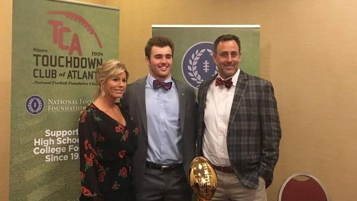 Jake Fromm poses for a photo at the Touchdown Club of Atlanta awards banquet with his mother, Lee Fromm, and his father, Emerson Fromm.