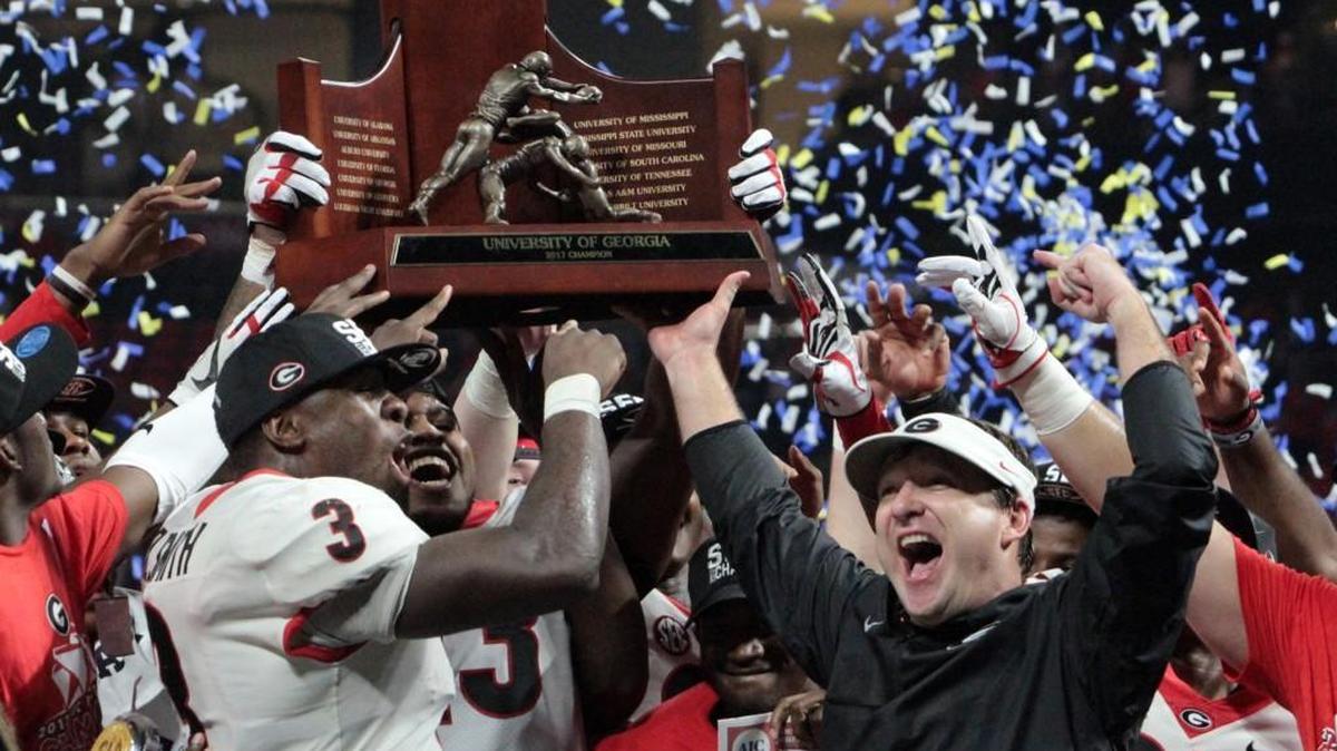 Kirby Smart celebrates with his team after Georgia won the SEC Championship.