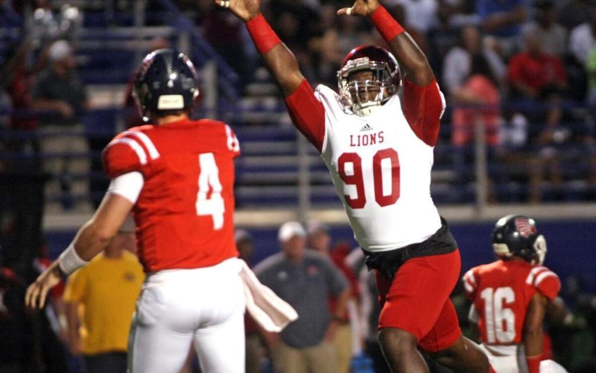 Chauncey Rivers rushes the passer and attempts to deflect a pass during East Mississippi’s game against Itawamba.