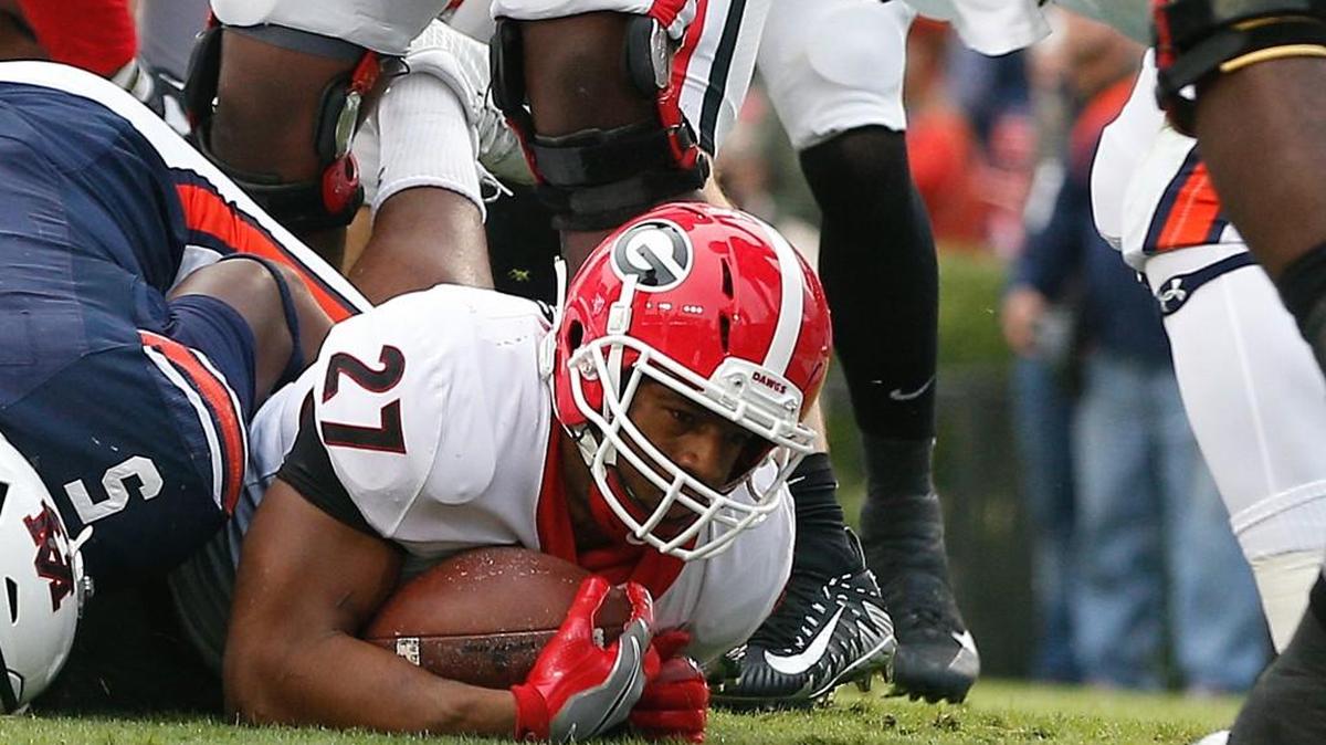 Georgia running back Nick Chubb (27) scores a touchdown against Auburn.