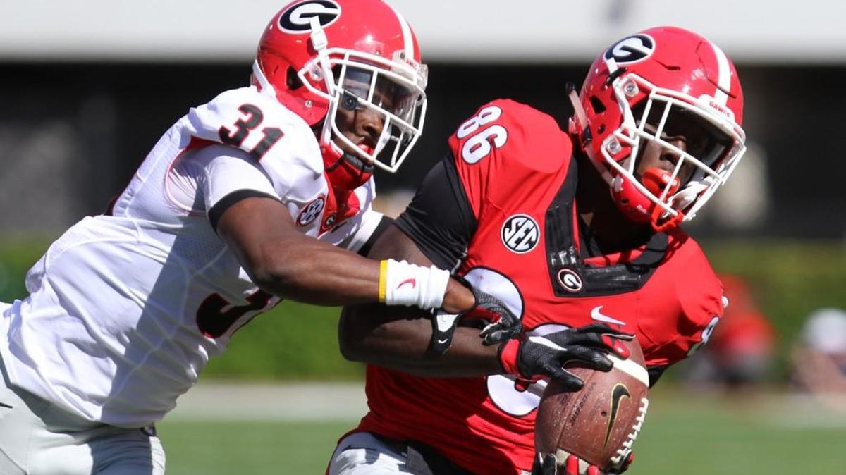 True freshman receiver Riley Ridley catches a pass with cornerback Shattle Fenteng in coverage.