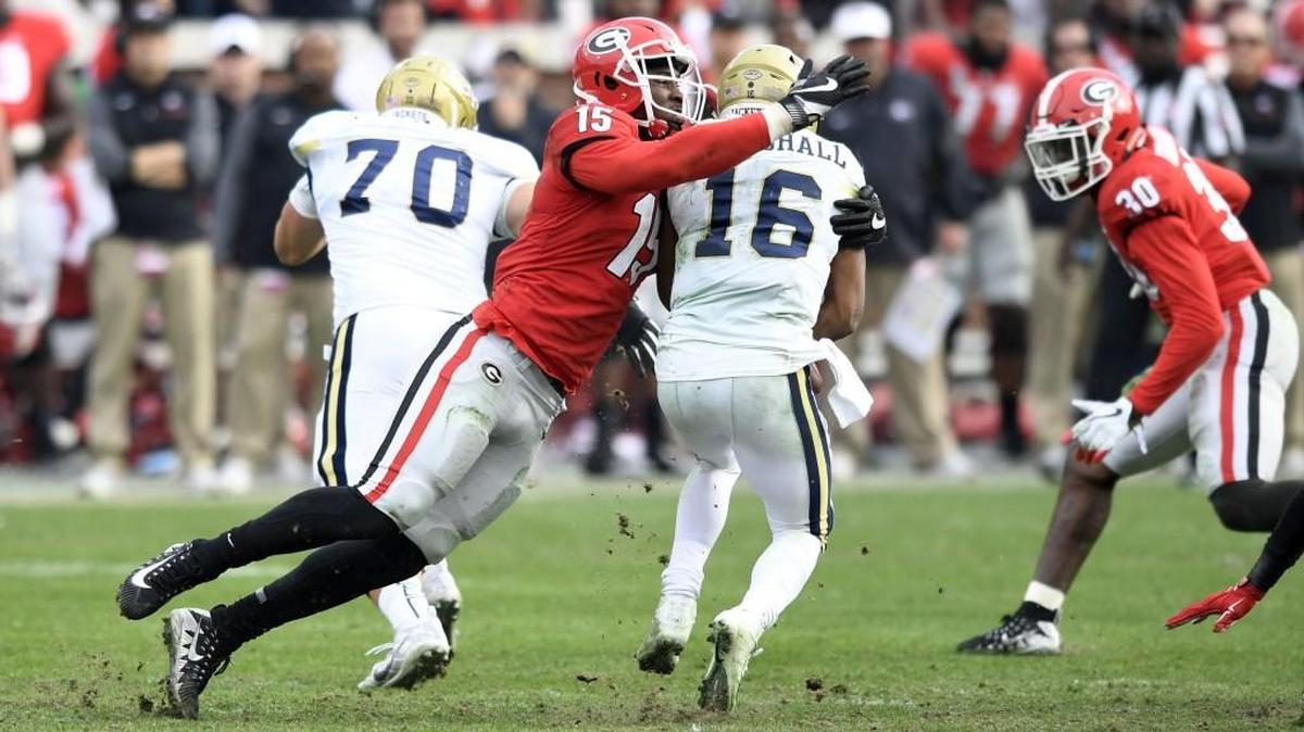 Georgia's D'Andre Walker (15) tackles Georgia Tech quarterback TaQuon Marshall (16) during the second half.
