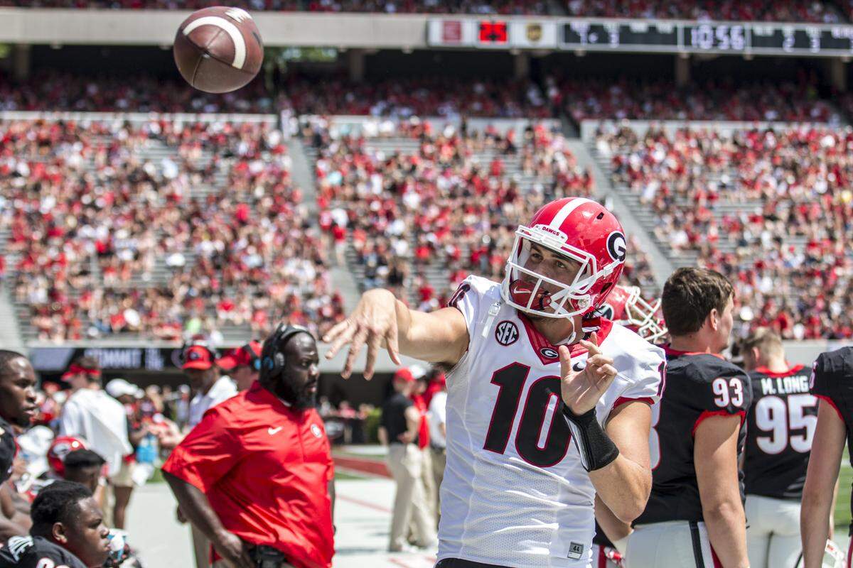 Jacob Eason throws a pass on the sideline at this year's G-Day game. 