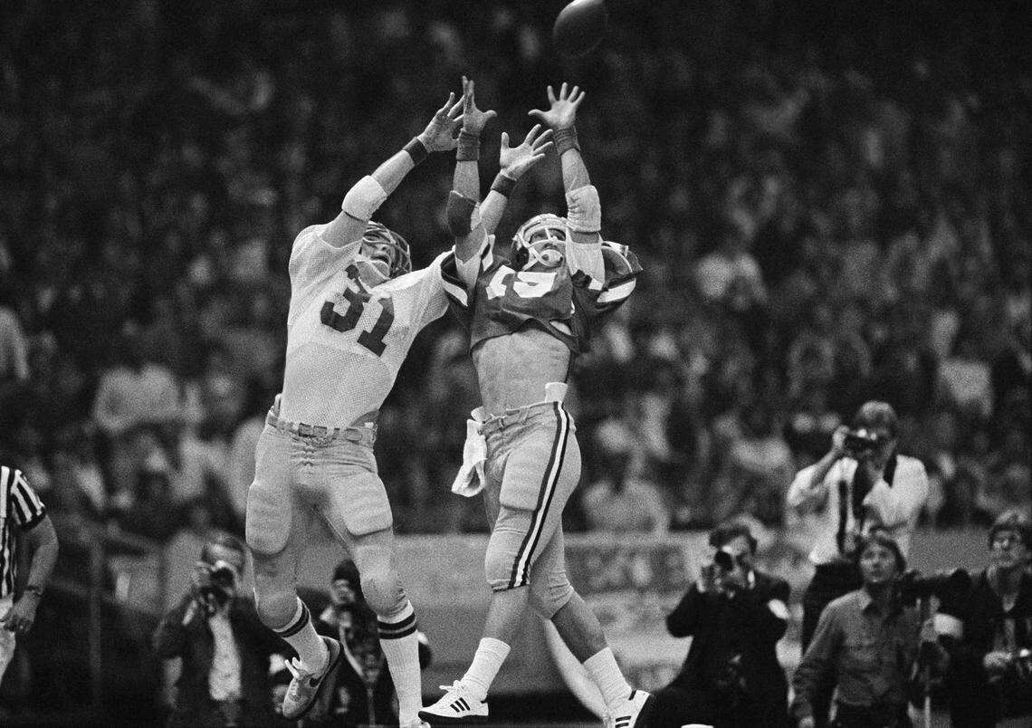 Scott Woerner comes down with the first of his two interceptions against Notre Dame. 