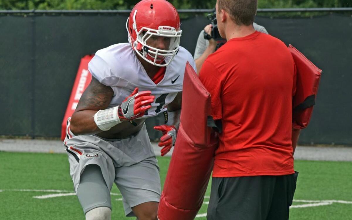 Georgia linebacker Chauncey Manac (91) is isntructed during a drill at practice.