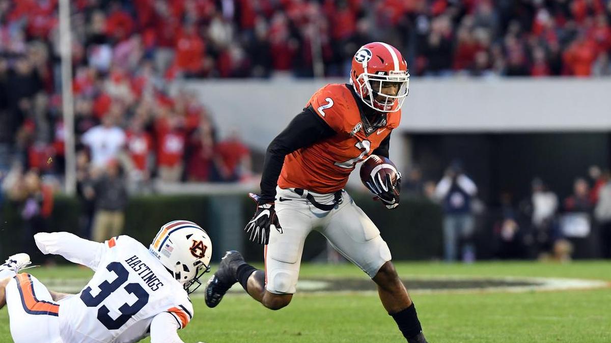 Georgia defensive back Maurice Smith returns an interception for a touchdown against Auburn.