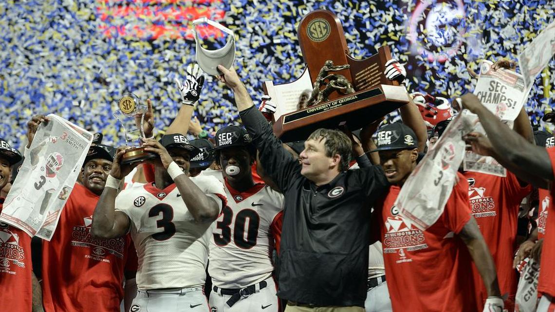 The Georgia Bulldogs celebrate their SEC Championship win over Auburn, 28-7.