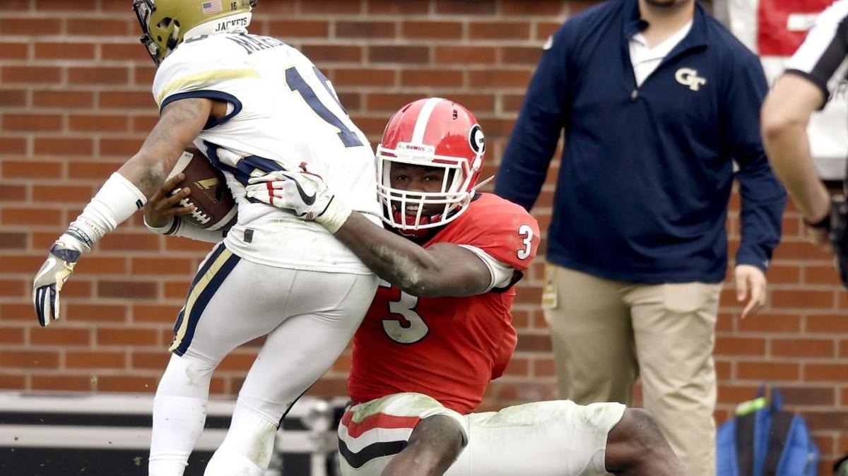Georgia linebacker Roquan Smith (3) tackles Georgia Tech quarterback TaQuon Marshall (16) behind the line of scrimmage during their game Saturday.