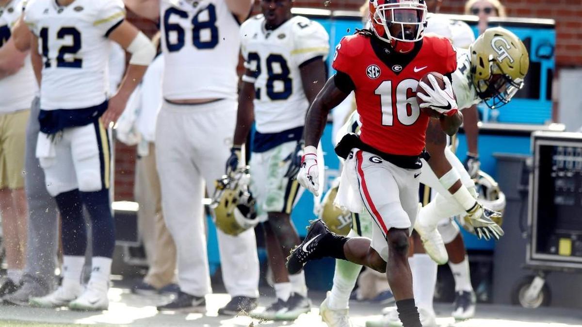 Georgia receiver Ahkil Crumpton (16) runs down the sideline for a touchdown during the Bulldogs' 38-7 win over Georgia Tech Saturday.