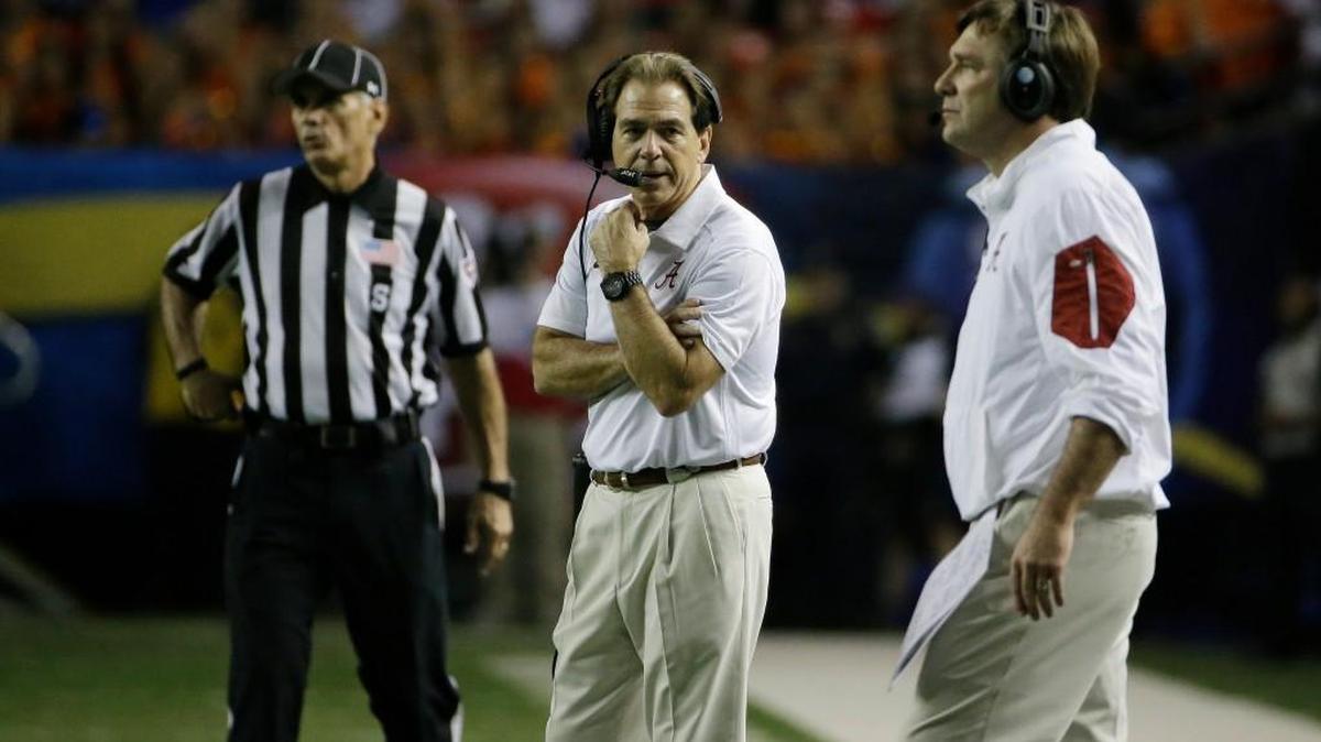 Alabama head coach Nick Saban, center, speaks with Defensive Coach Kirby Smart during the second half of the 2015 SEC Championship.